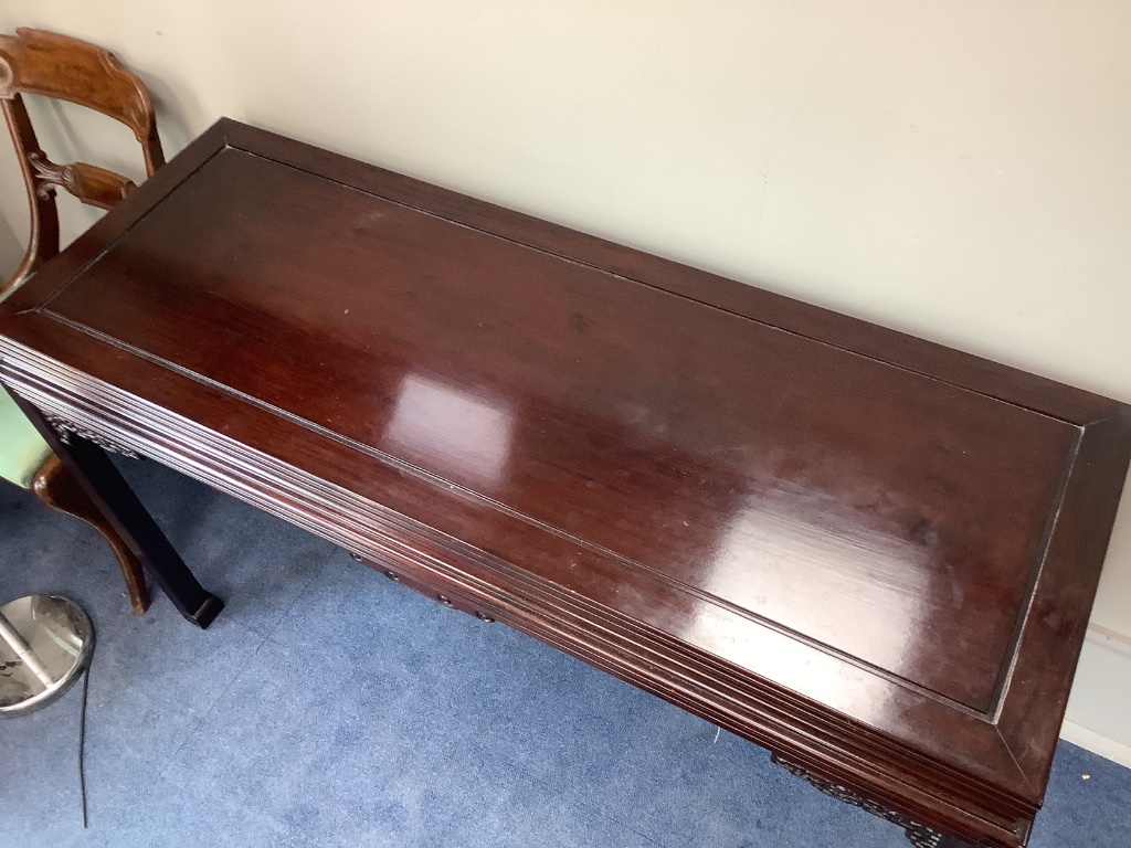 A 20th century Chinese hardwood side or serving table, width 140cm depth 52cm height 84cm